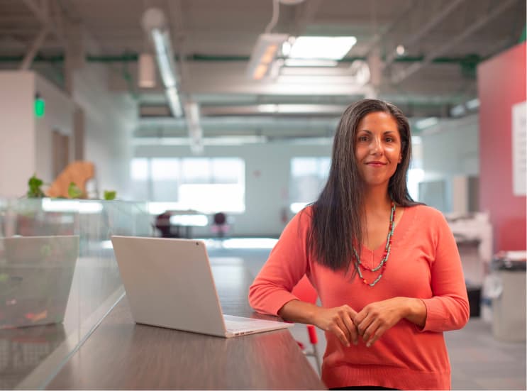 Woman standing near desk